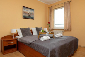 Apartamenty przy plaży Reymonta by Noclegi Renters